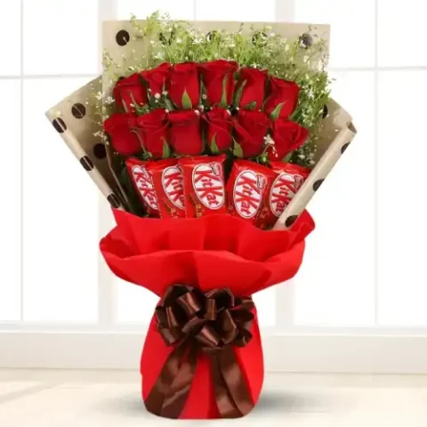 Rose Choco Bouquet with 12 fresh red roses, gypsophilia, KitKat chocolates, and greeting card for same day flower delivery in Karachi
