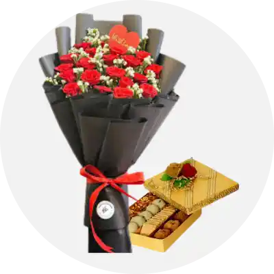 Beautiful bouquet of fresh flowers paired with traditional mithai, available for online delivery in Karachi, perfect for celebrations and gifting.