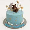 Blue boy baby shower cake with teddy bear, moon, and stars decorations, perfect for celebrations with online cakes delivery in Karachi.