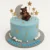 Blue boy baby shower cake with teddy bear, moon, and stars decorations, perfect for celebrations with online cakes delivery in Karachi.
