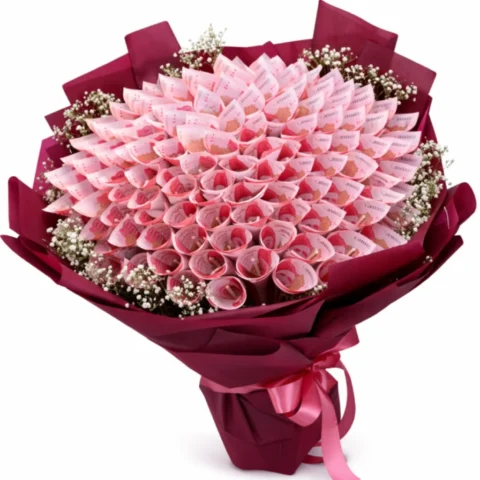 5K Eidi Money Bouquet with 100-rupee notes, wrapped in burgundy paper with baby’s breath, for online money bouquet delivery in Karachi.